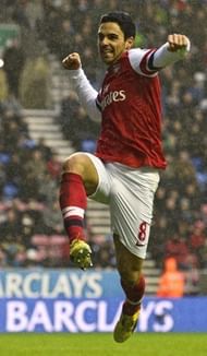 Arsenal's Spanish midfielder Mikel Arteta celebrates scoring the opening goal December 22, 2012.
